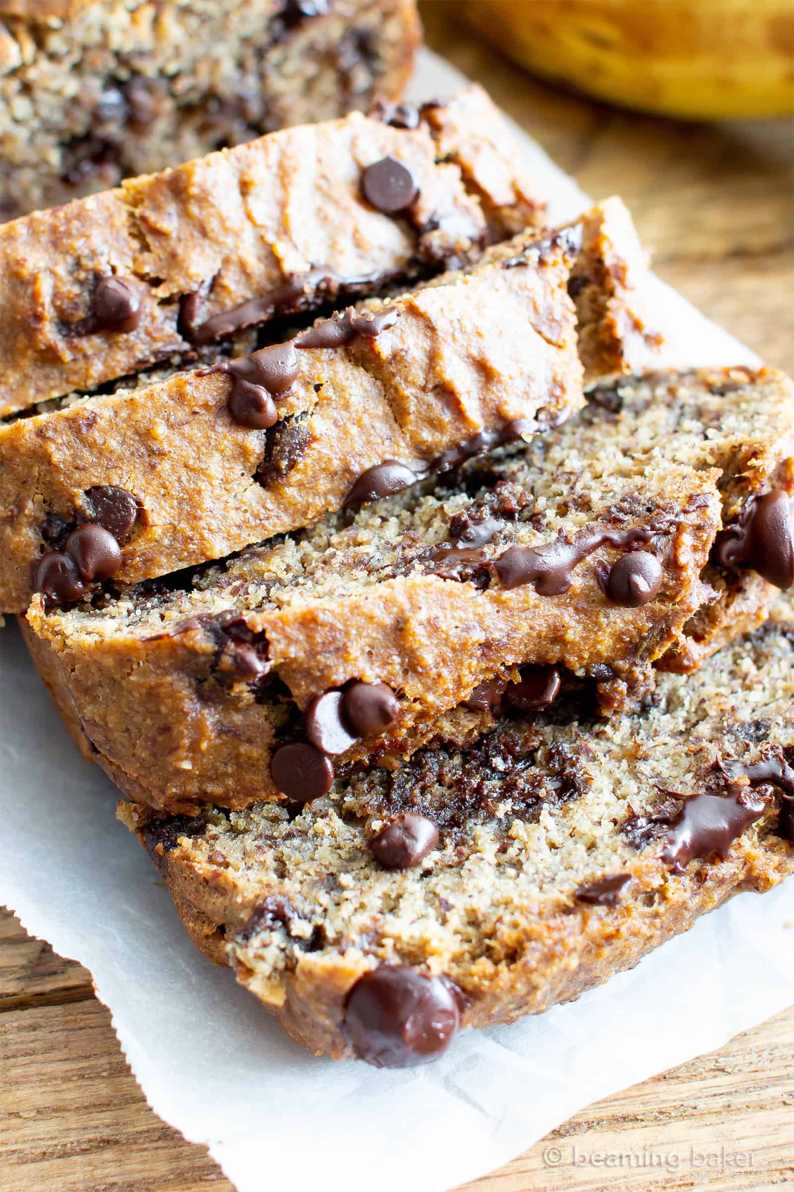 Best Moist Chocolate Chip Banana Bread Recipe (V, GF): a one bowl recipe for deliciously moist banana bread bursting with chocolate and made with healthy, whole ingredients. #Vegan #GlutenFree #DairyFree #Healthy #QuickBreads | Recipe at BeamingBaker.com