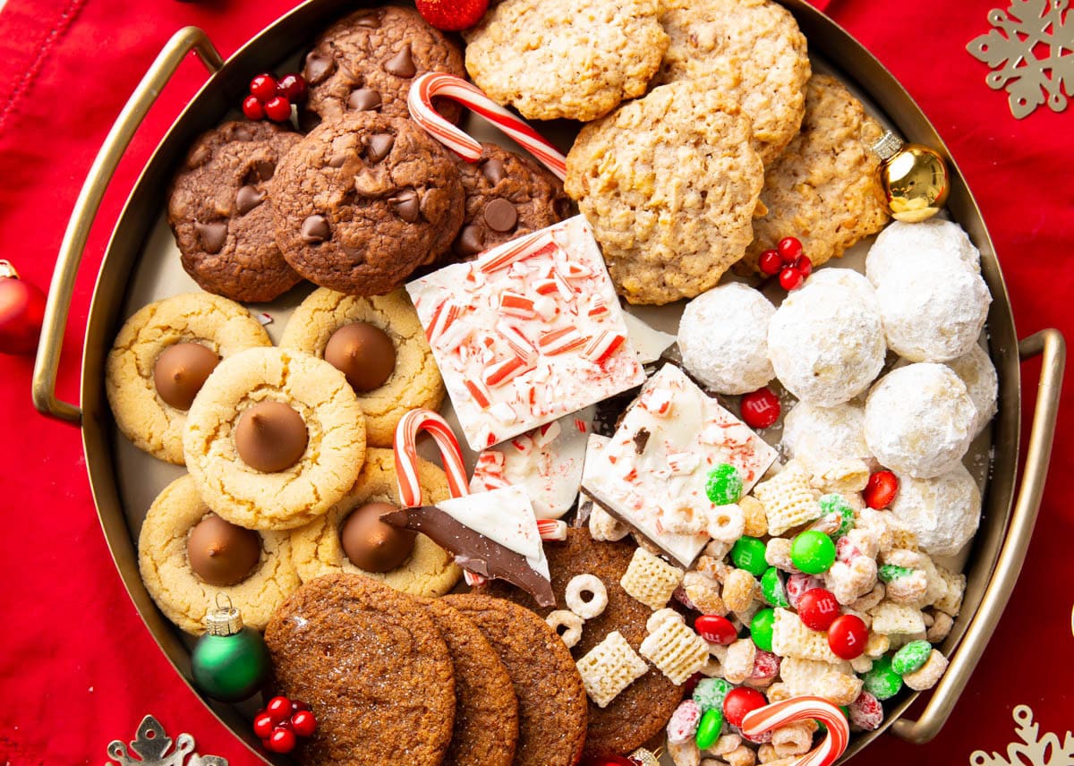 A dessert spread filled with easy Christmas treats like reindeer chow and brownie cookies.