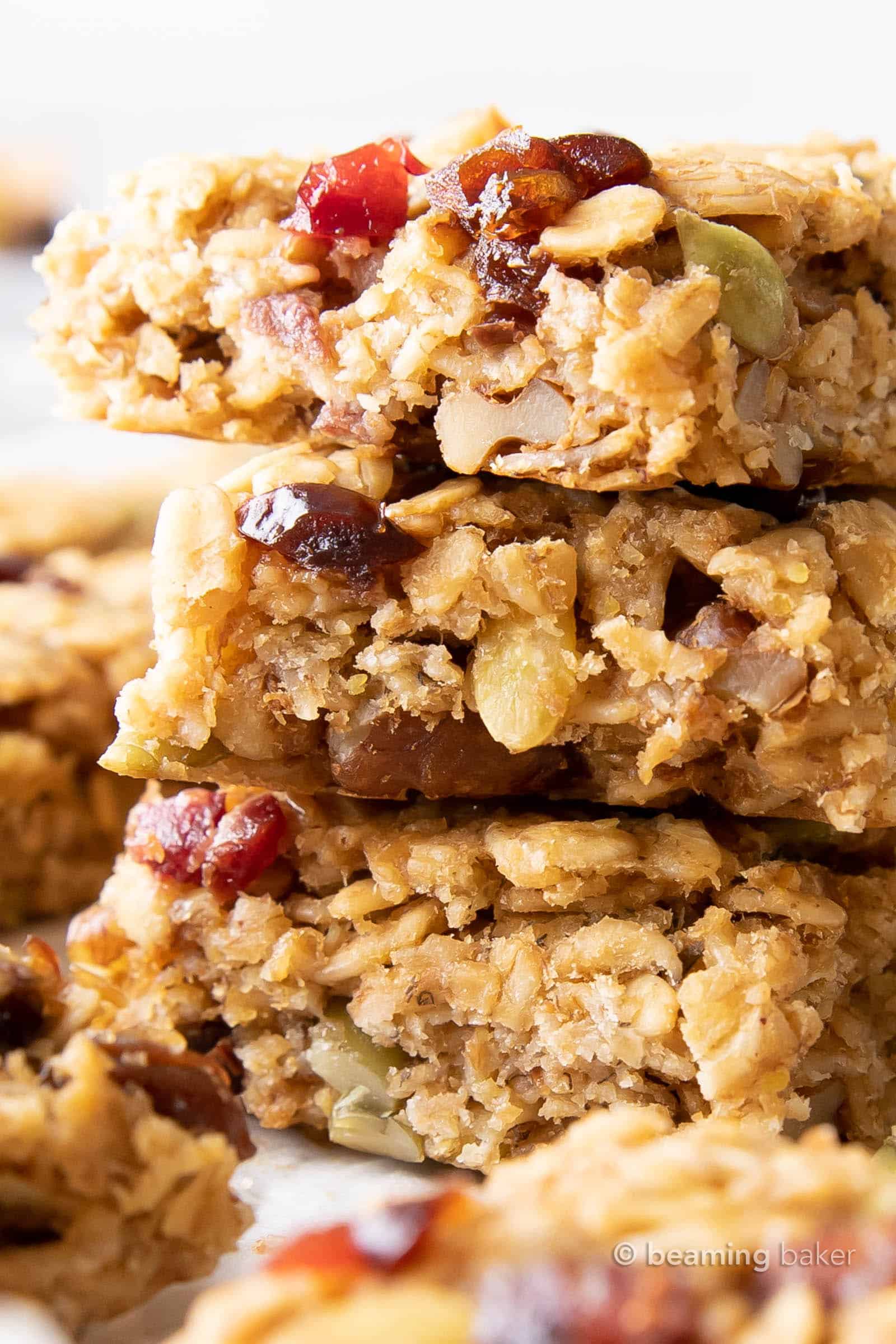 Closeup view of the texture in this breakfast bar recipe with chopped nuts and fruits peeping out of bars