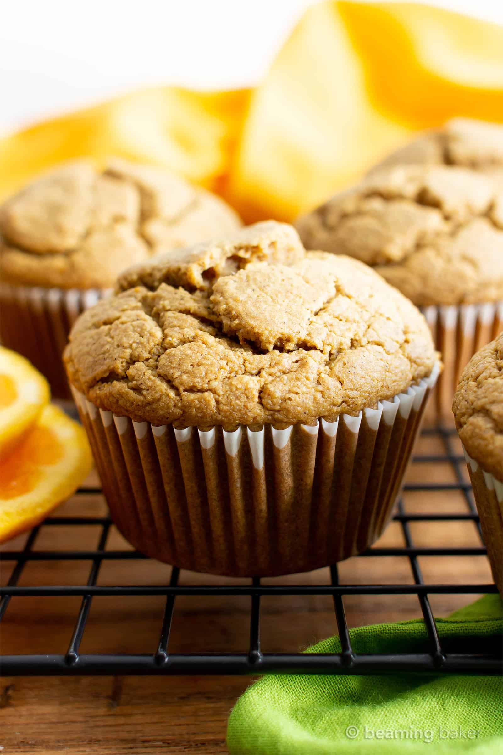 Healthy Gluten Free Orange Cardamom Muffins Recipe (V, GF): an easy, 1-bowl recipe for soft, fluffy orange muffins with a hint of delicious cardamom flavor. Made with healthy ingredients. #Vegan #GlutenFree #DairyFree #HealthyMuffins #GlutenFreeVegan #BeamingBaker | Recipe at BeamingBaker.com