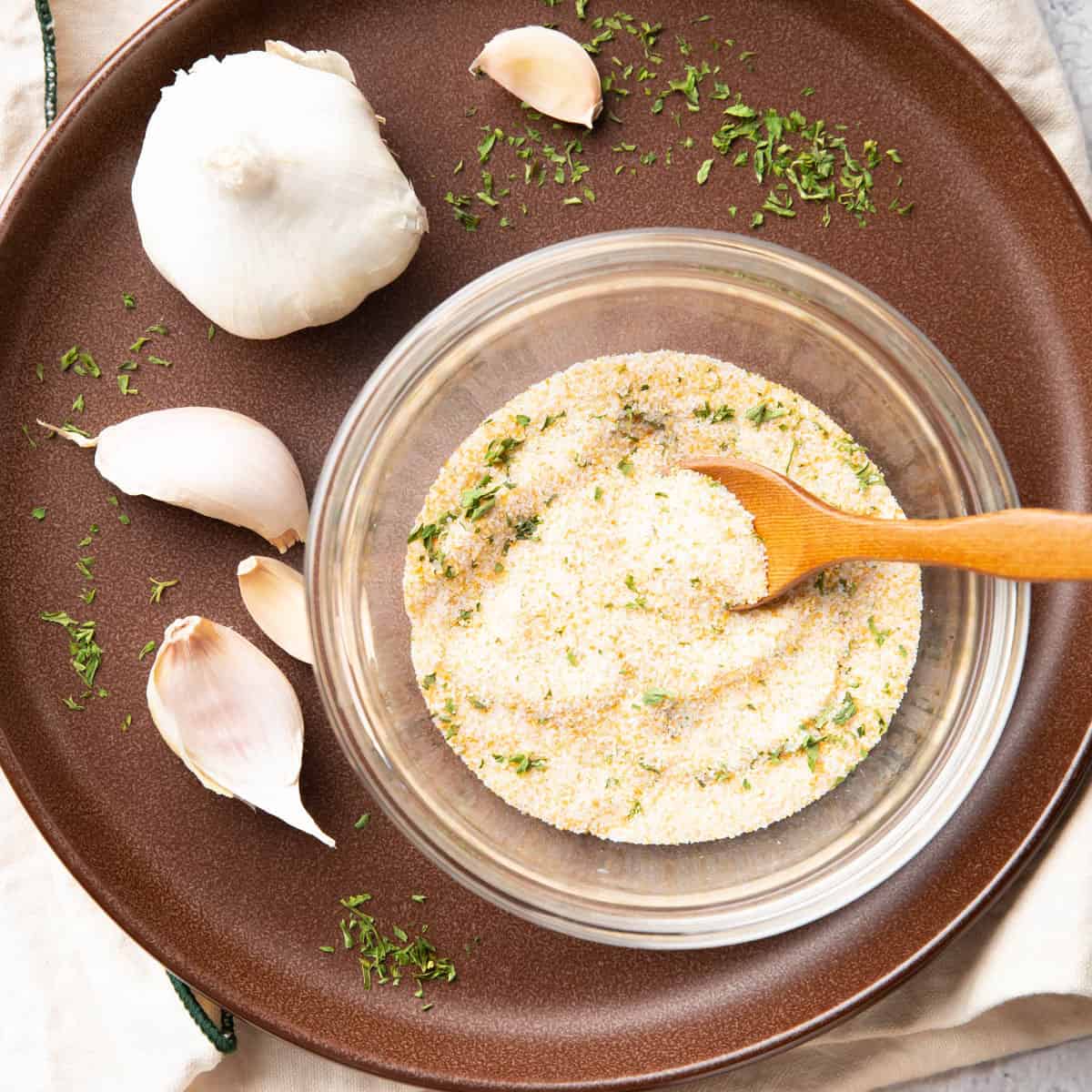 Garlic Salt with Cloves of Garlic on a Plate