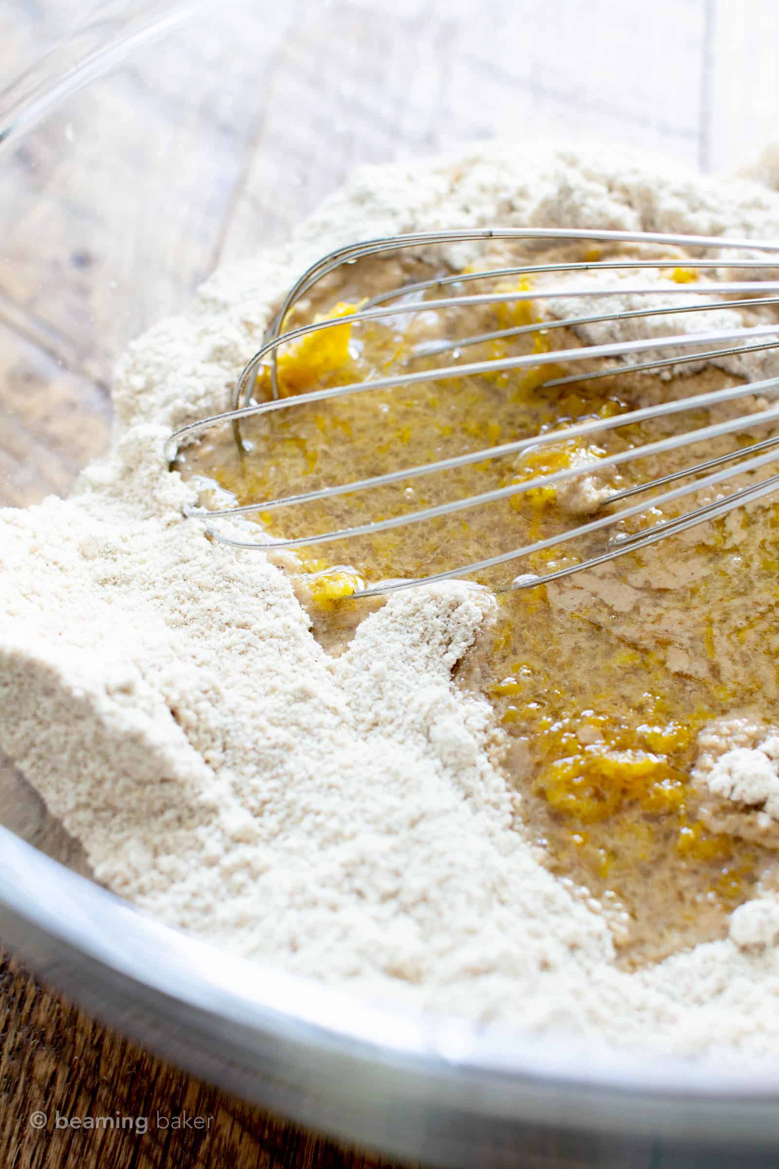 Wet ingredients added to dry ingredients for gluten free vegan muffin recipe